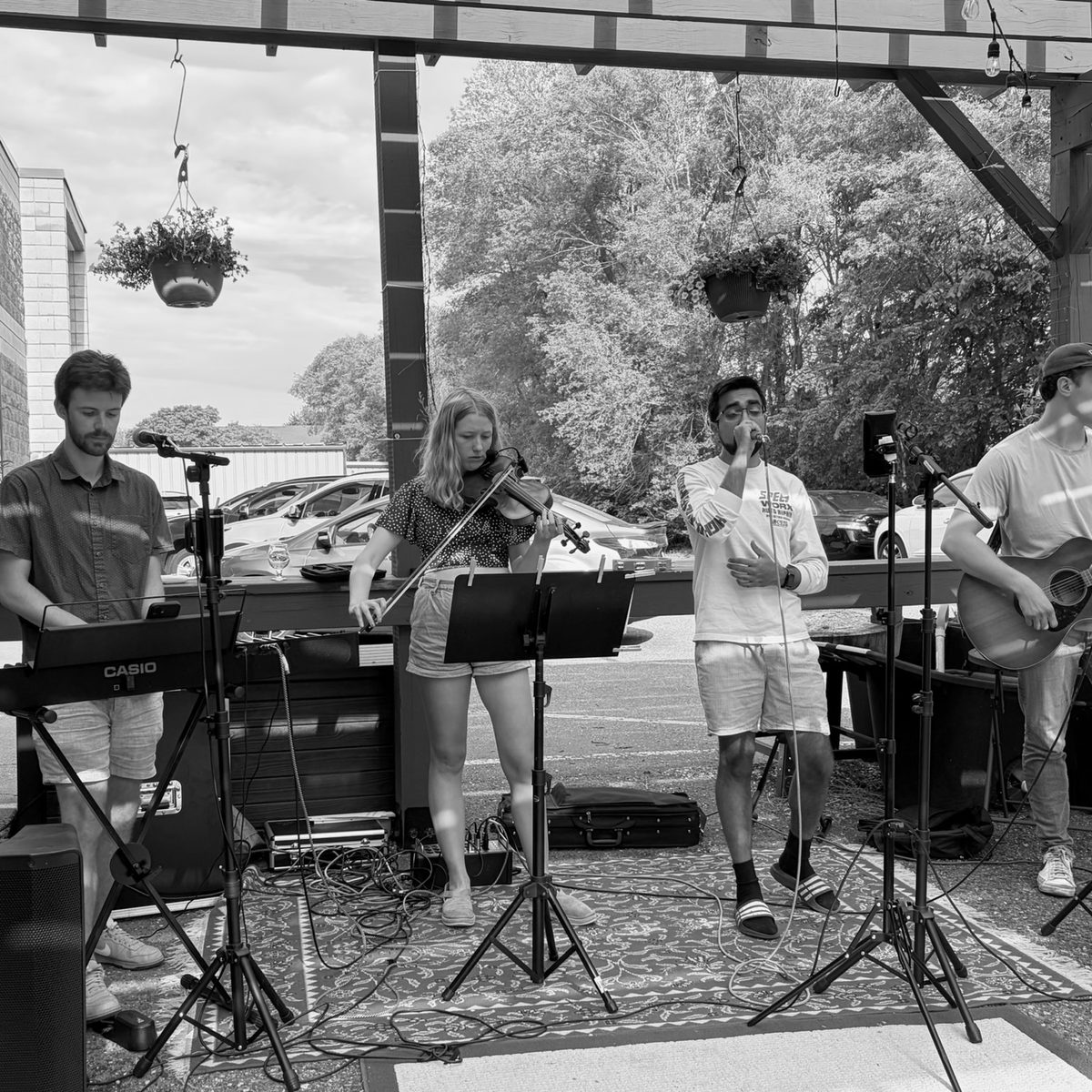 Always Tired playing an outdoor patio set on a summer afternoon
